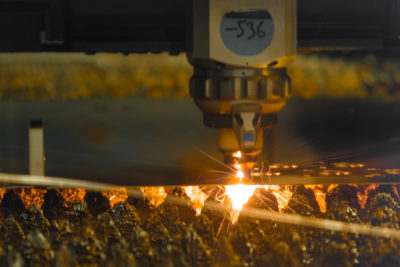 laser cutter carves thin metal sheet with sparks i 2023 11 27 05 19 31 utc scaled